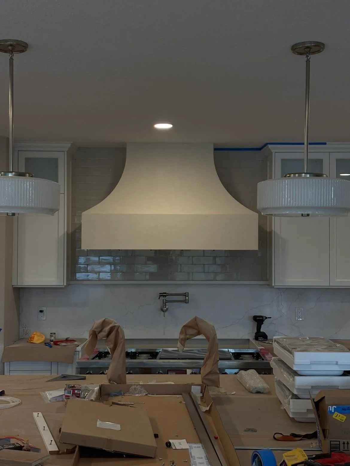Custom kitchen hood before Fresco Harmony finish, smooth drywall ready for application