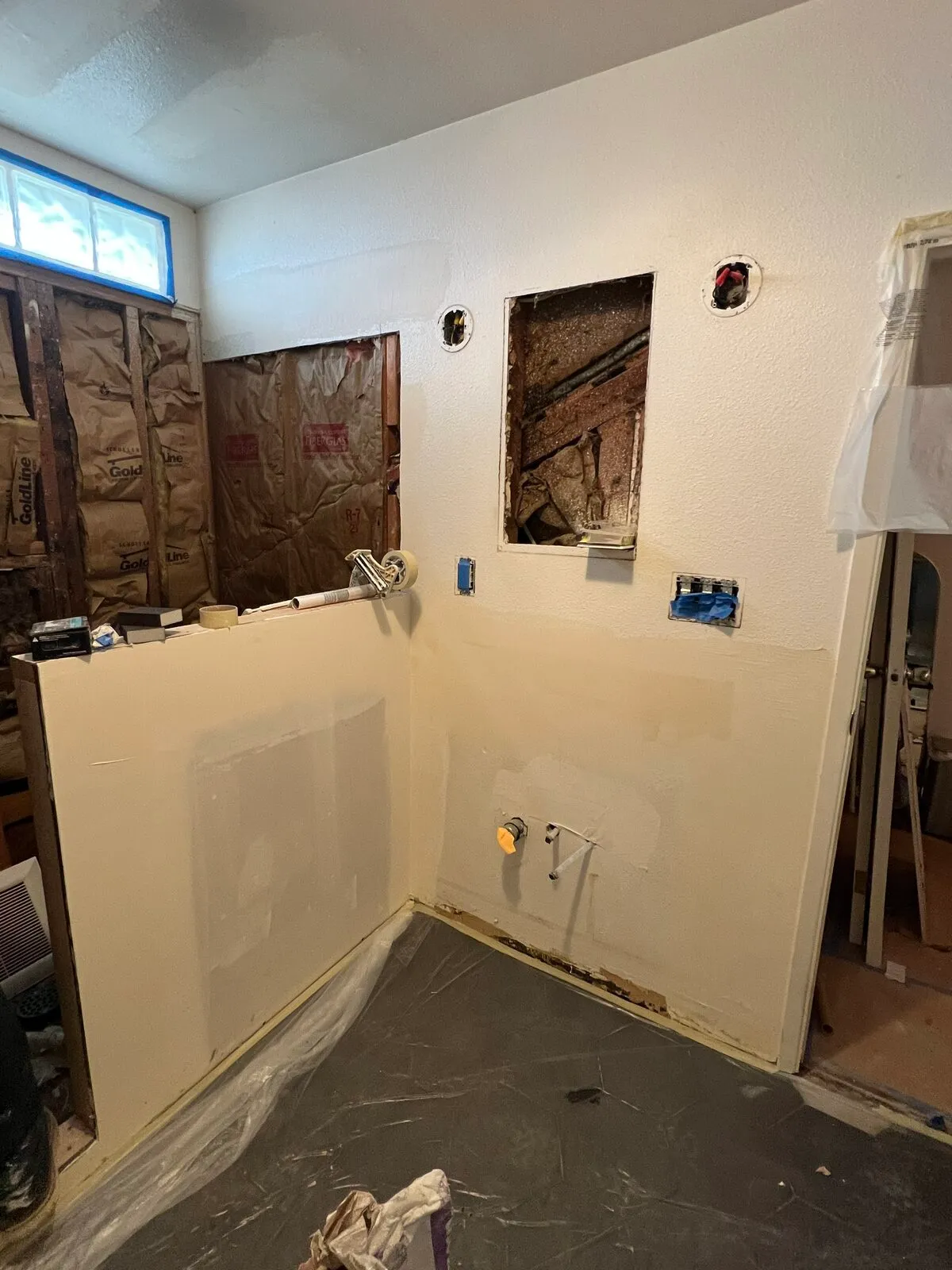 Wall patch work in bathroom remodel before texture matching