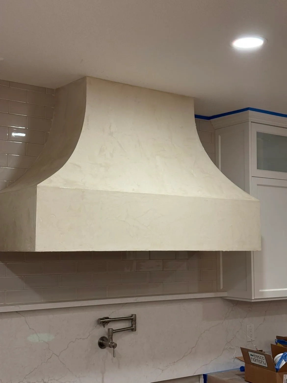 Custom kitchen hood with Fresco Harmony hand-applied finish nearly complete