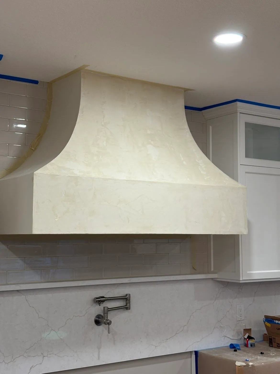 Finished custom kitchen hood with Fresco Harmony Lone Coffee finish
