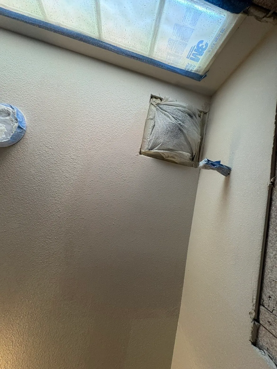 Custom shower wall separation construction in progress during bathroom remodel