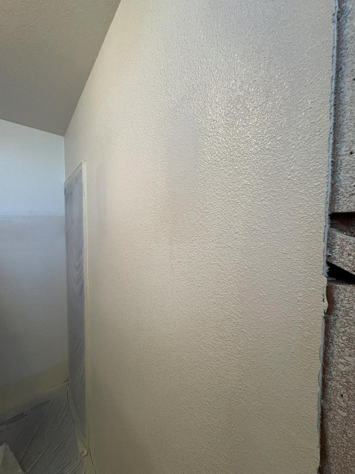 Bathroom remodel drywall work near shower fixtures