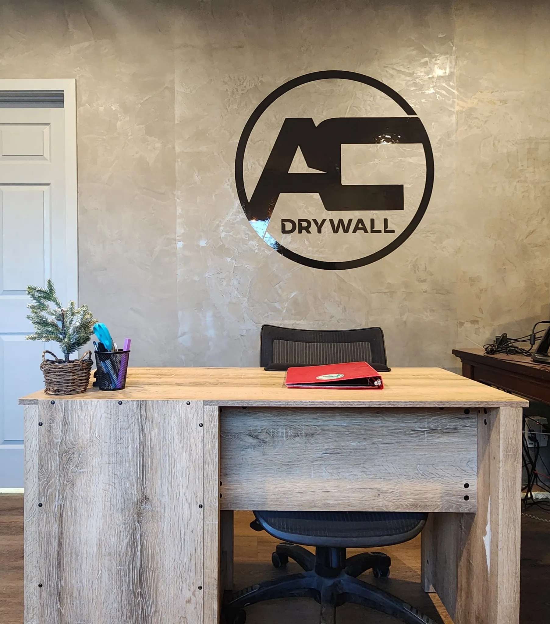 AvilaCo Drywall office featuring fresco harmony textured wall with company logo in Vancouver WA