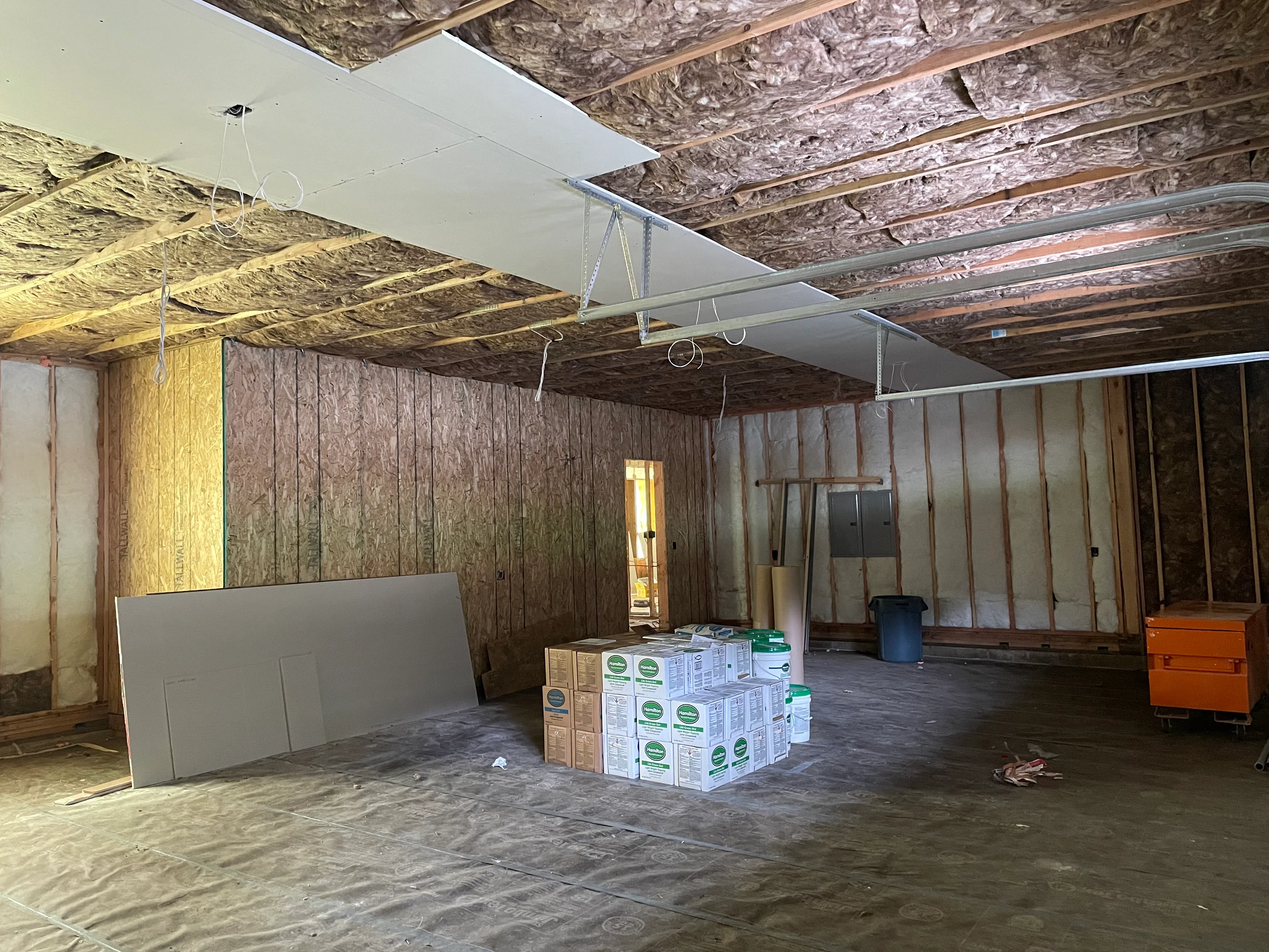 Batt insulation fitted between wall studs in new home construction project