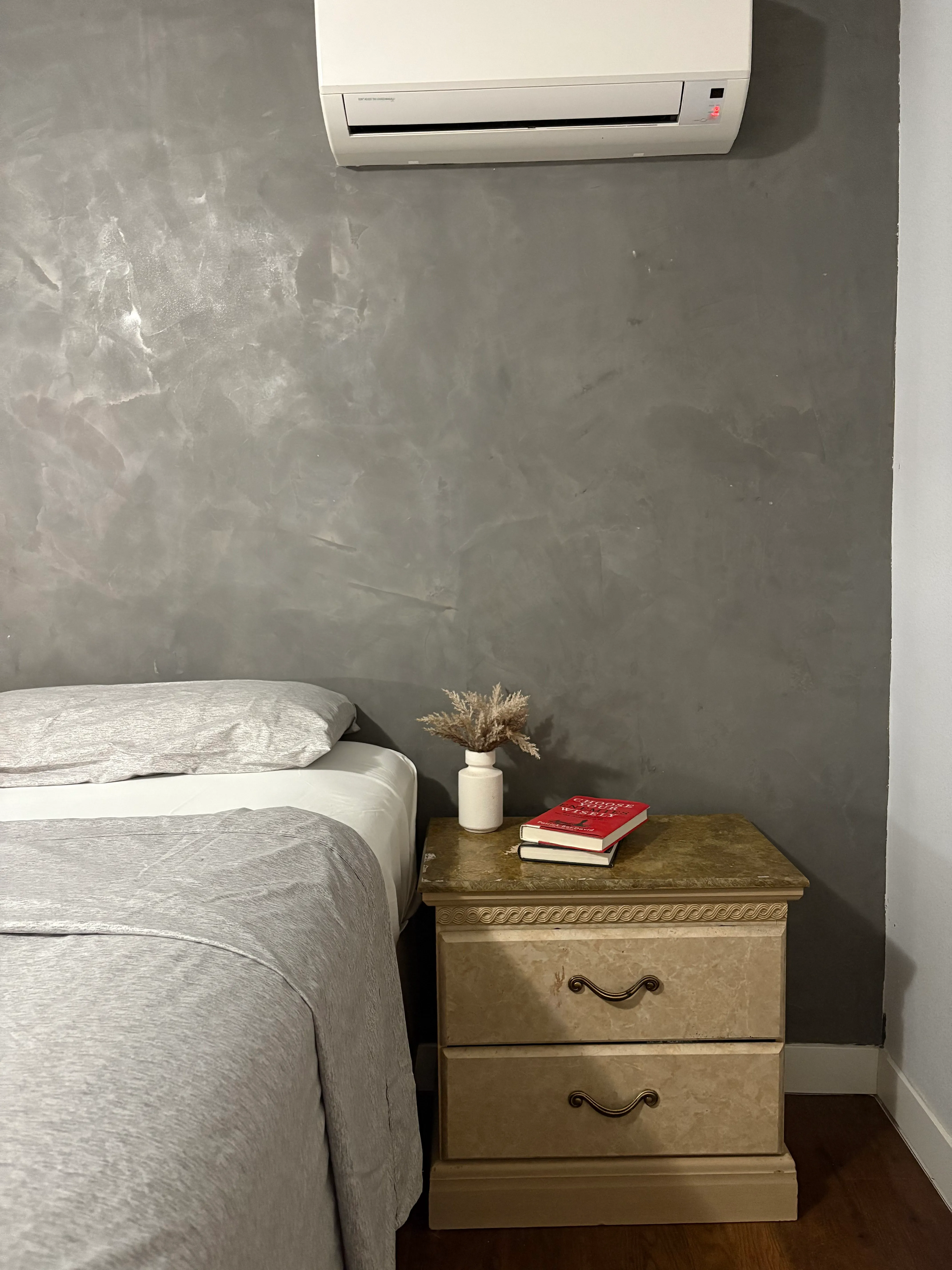 Bedroom fresco wall finish with smooth textured walls and warm neutral tones