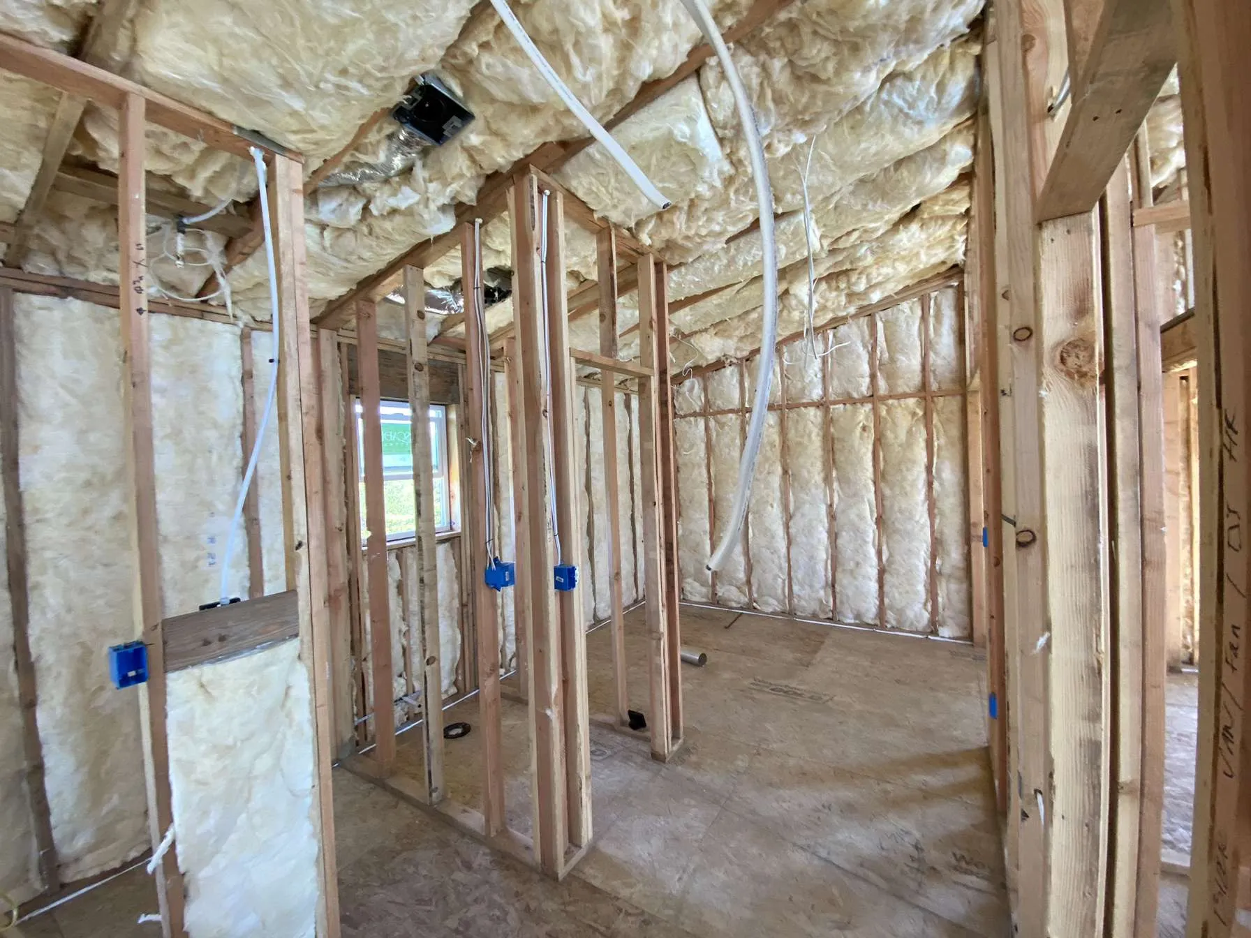Wall insulation batt installation before drywall