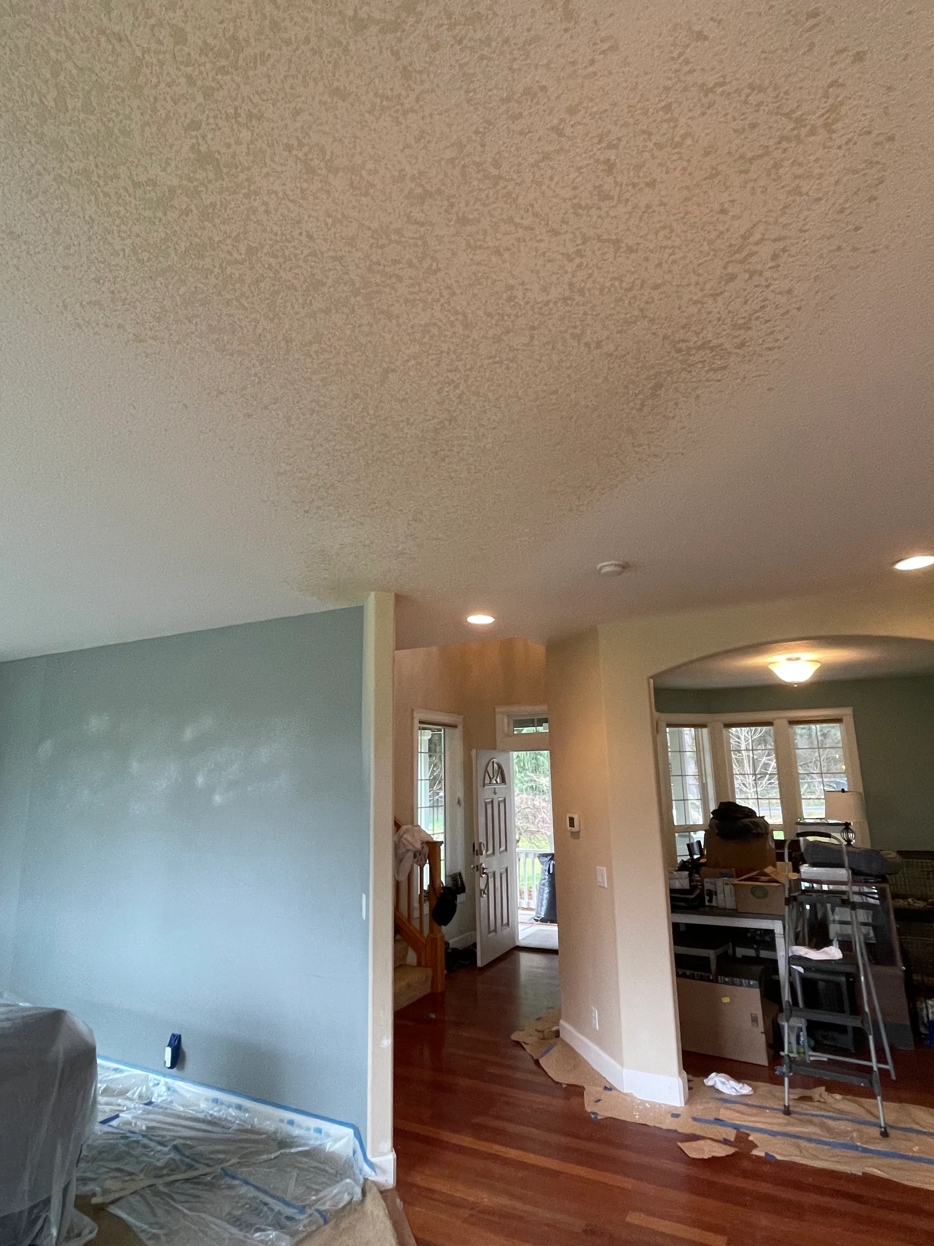 Drywall repair and texture matching in a living room