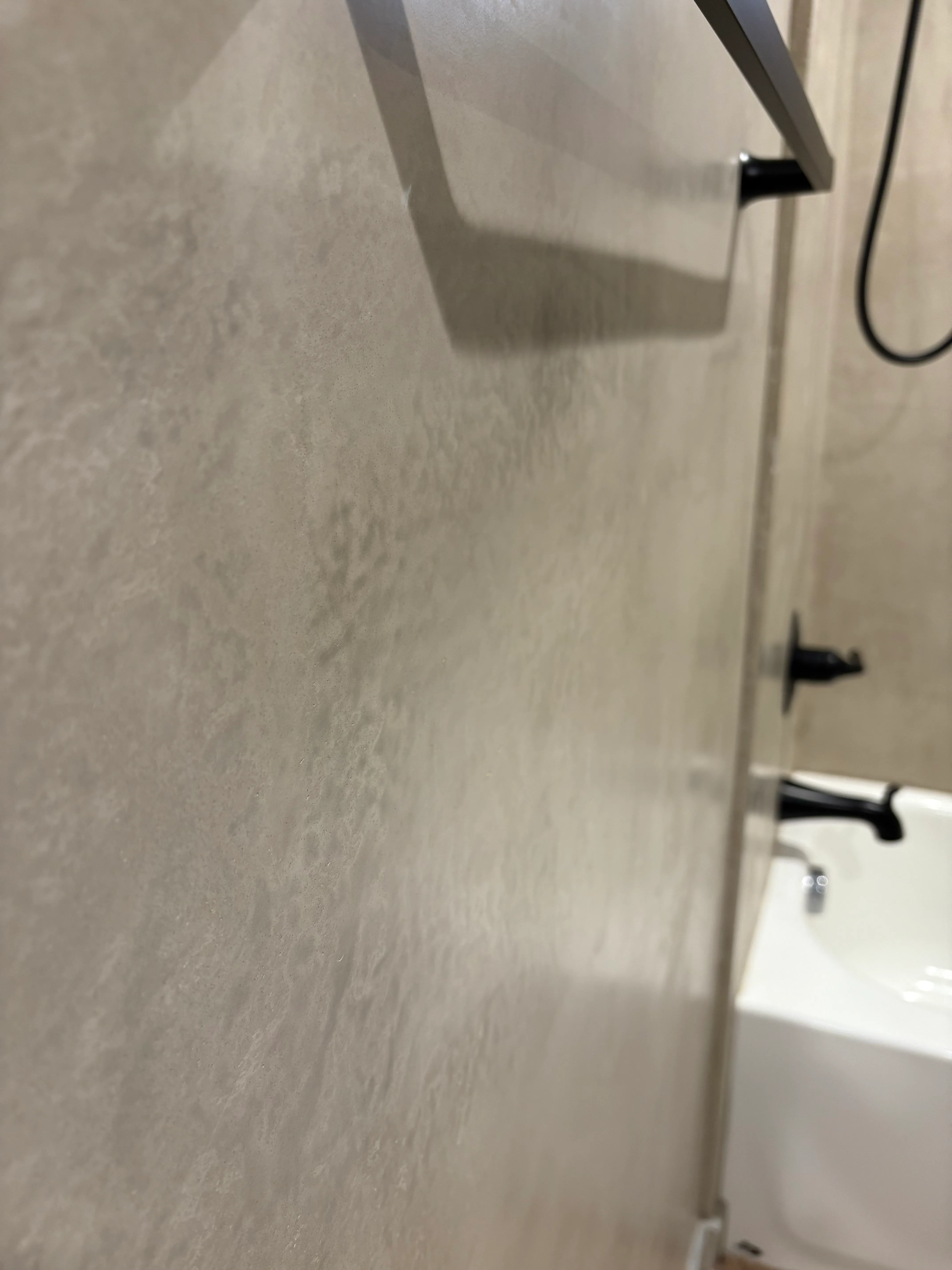 Close-up of venetian plaster wall texture showing hand-applied color depth and sheen