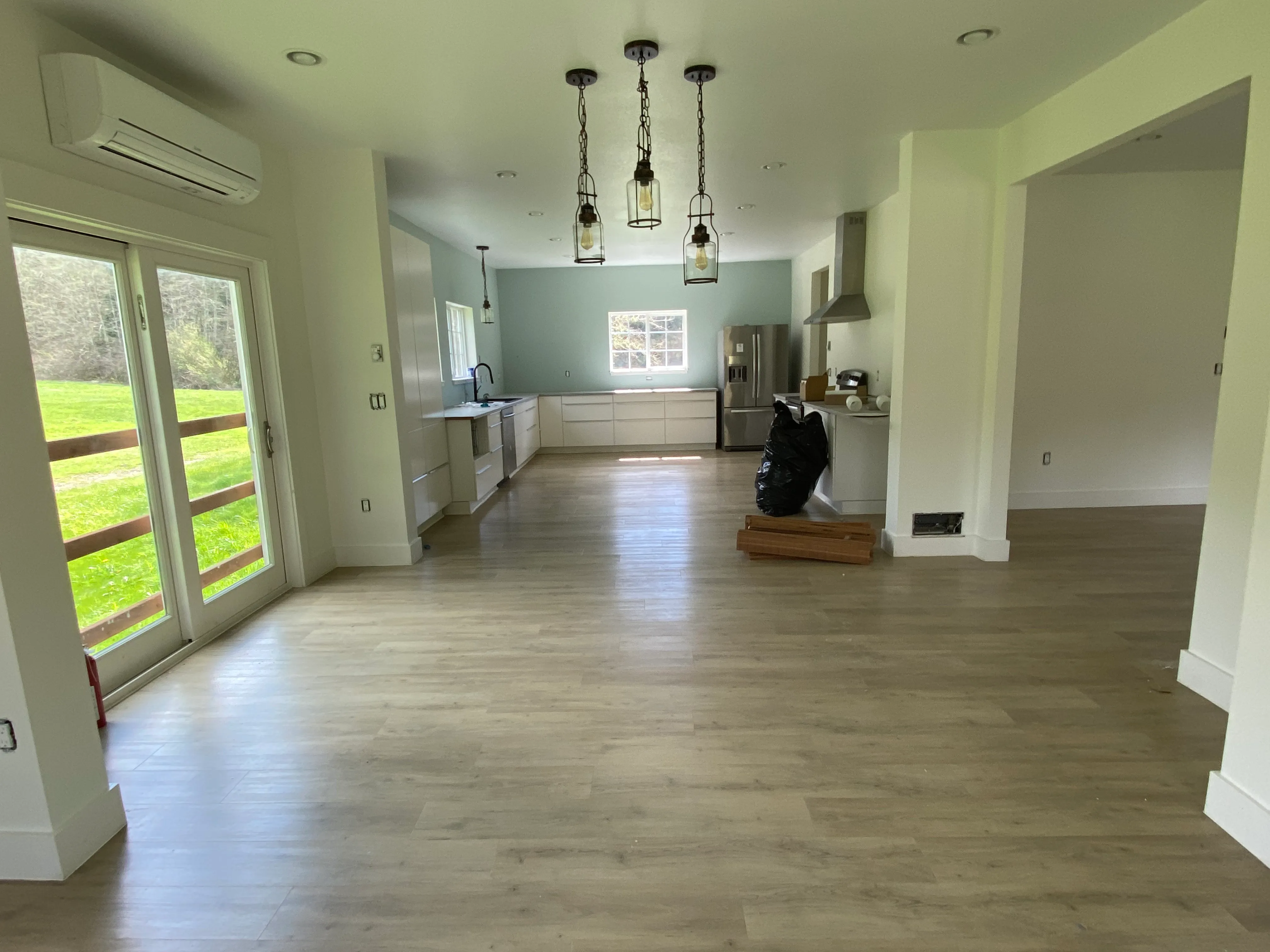Open concept interior with fresh drywall and paint in a renovated Longview, WA home