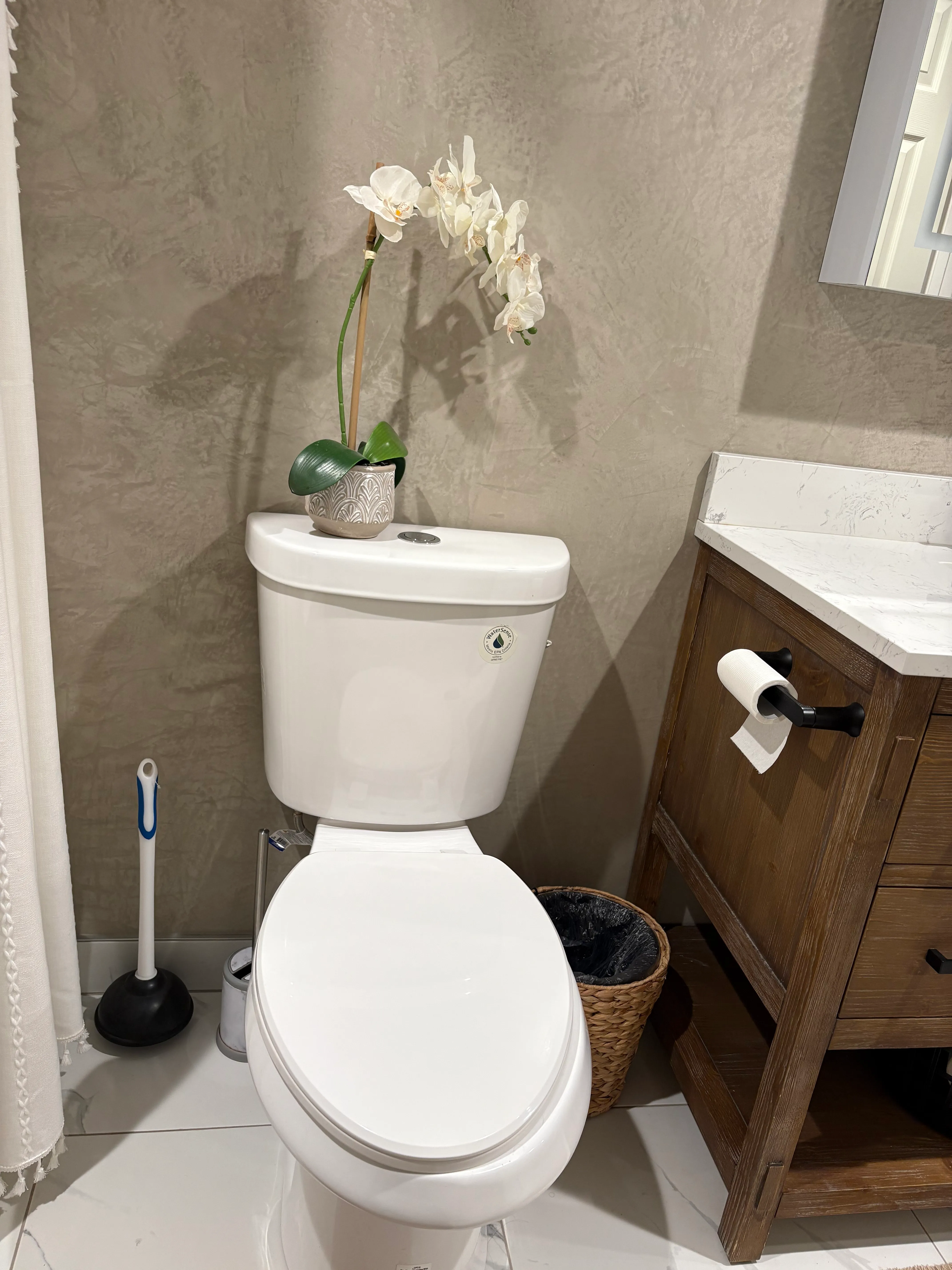 Smooth plaster finish on bathroom walls replacing dated tile by AvilaCo Drywall