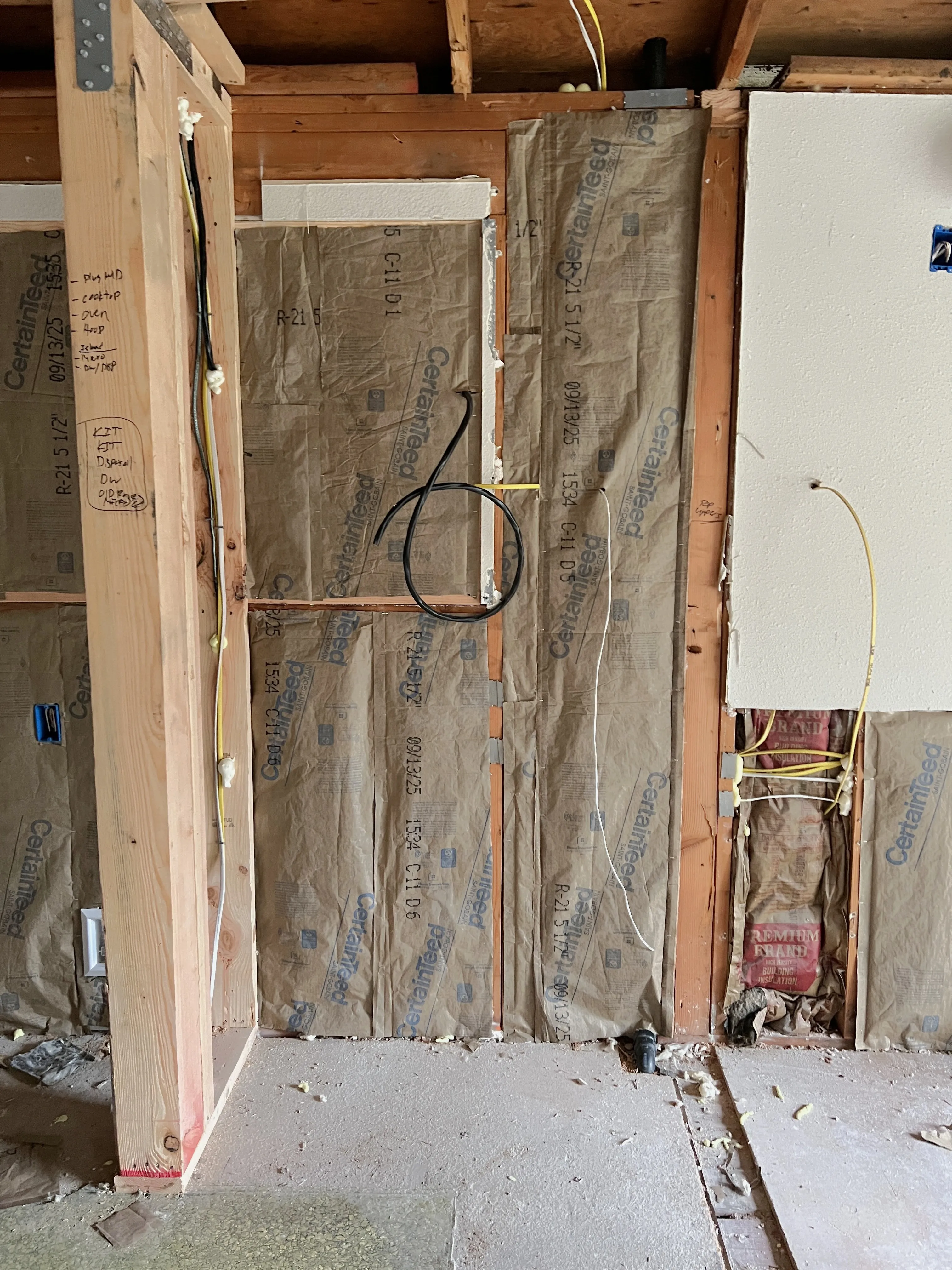 Batt insulation with vapor barrier installed in wall framing in Vancouver WA home